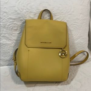 Mustard Yellow Michael Kors backpack.